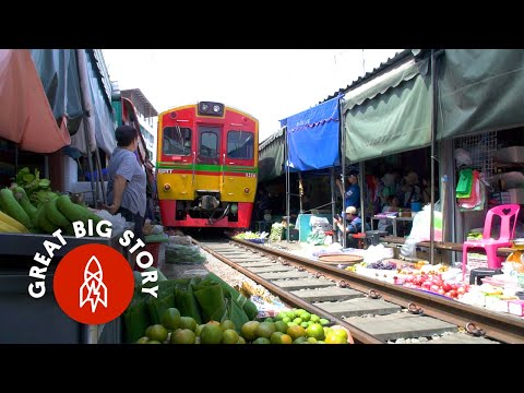 Watch a Train Run Through Thailand’s Most Dangerous Market