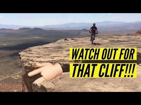 Rider almost falls off cliff