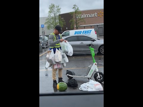 Man picks up Groceries on a Scooter!