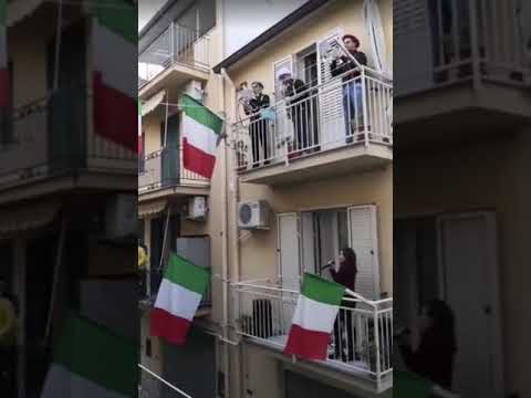 Coronavirus: quarantined Italians sing from balconies to lift spirits