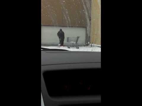 Idiot or genius shoveling snow at Wal-Mart?