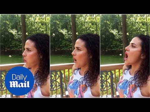 Woman shows off her impressive gum boomerang trick - Daily Mail