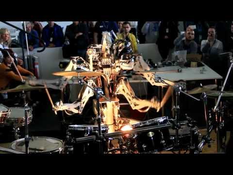4 Armed Mohawked Robot playing the drums