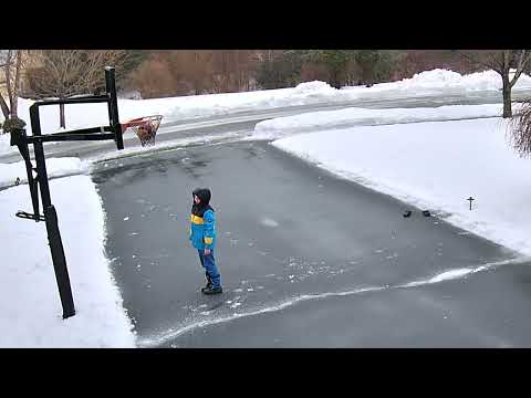 Kid&#039;s Basketball Gets Stuck Inside Frozen Basket During Cold Weather - 1289228