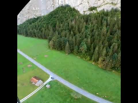 Base Jumper Front Flips off High Cliff in Switzerland - 1143570
