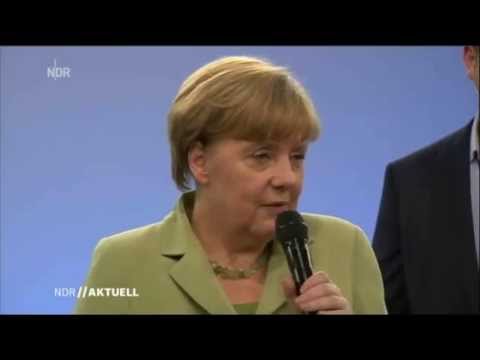 Angela Merkel konfrontiert mit weinendem Flüchtlingsmädchen