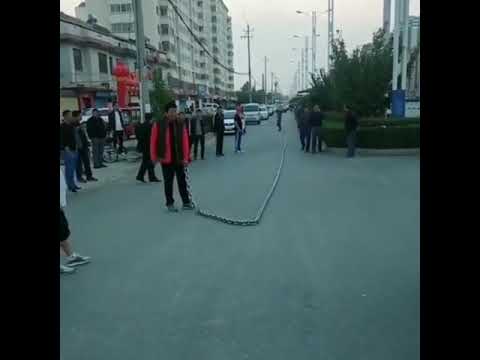 Guy Whipping a Massive Chain