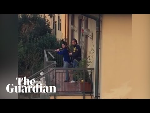 Coronavirus: neighbours play instruments from balconies as Italy stays under lockdown